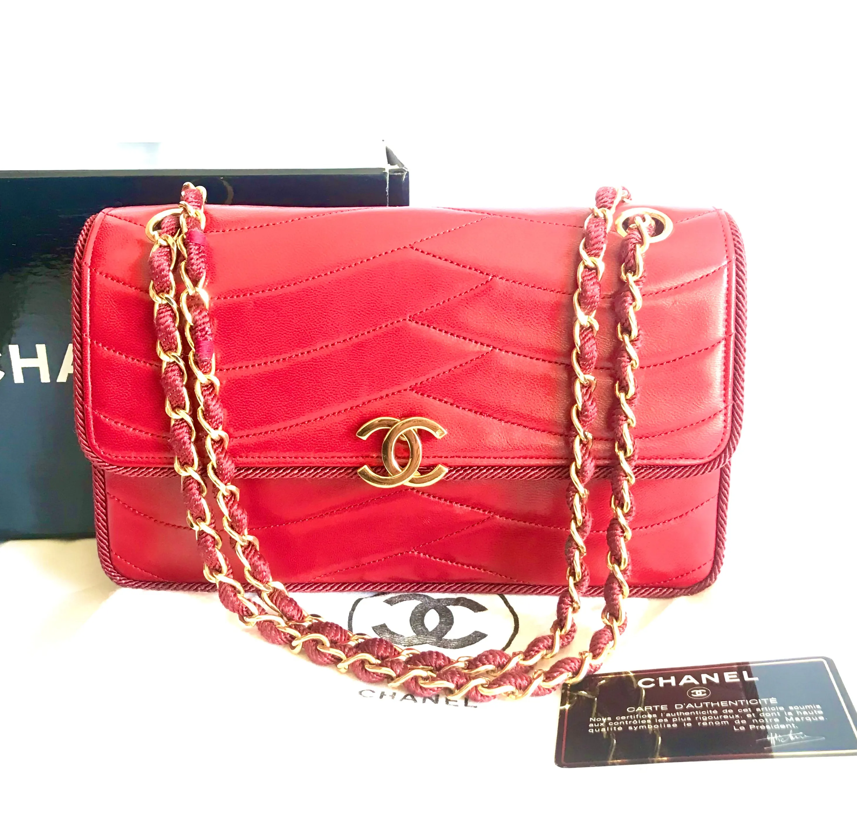 Vintage Chanel red 2.55 shoulder bag with wavy stitches and rope strings and gold chain strap. Very rare piece from the era. 050316r4