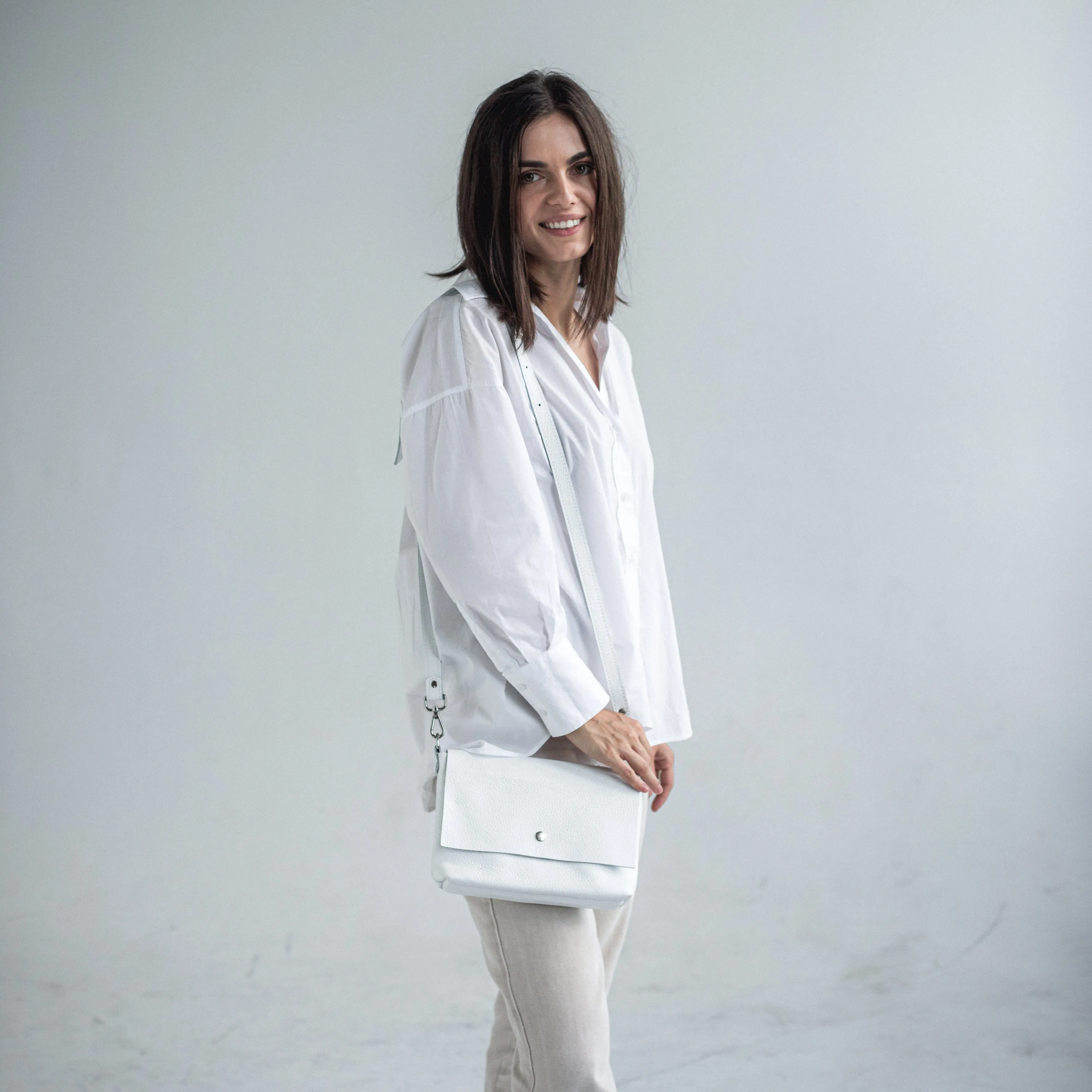 White pebbled leather crossbody bag